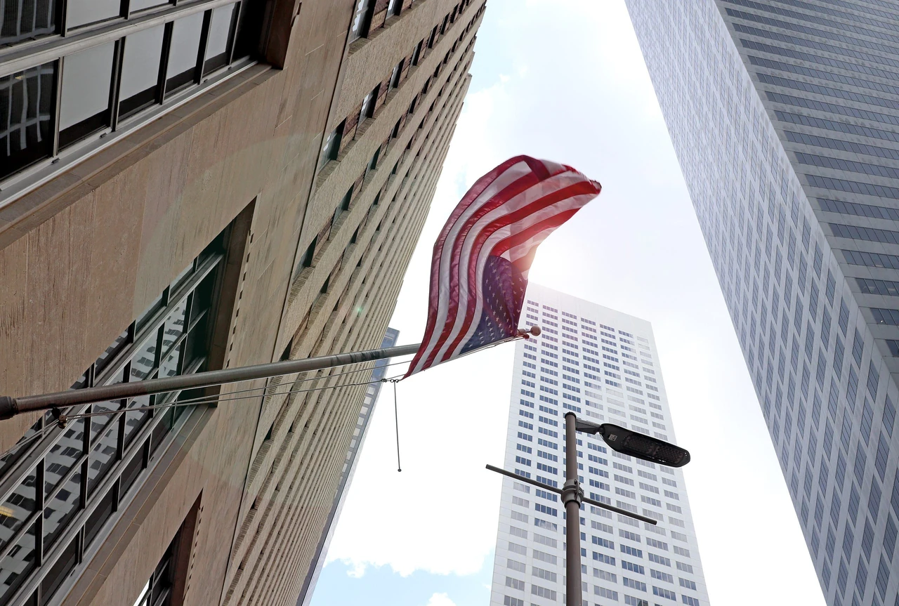 Downtown Houston towers with American flag