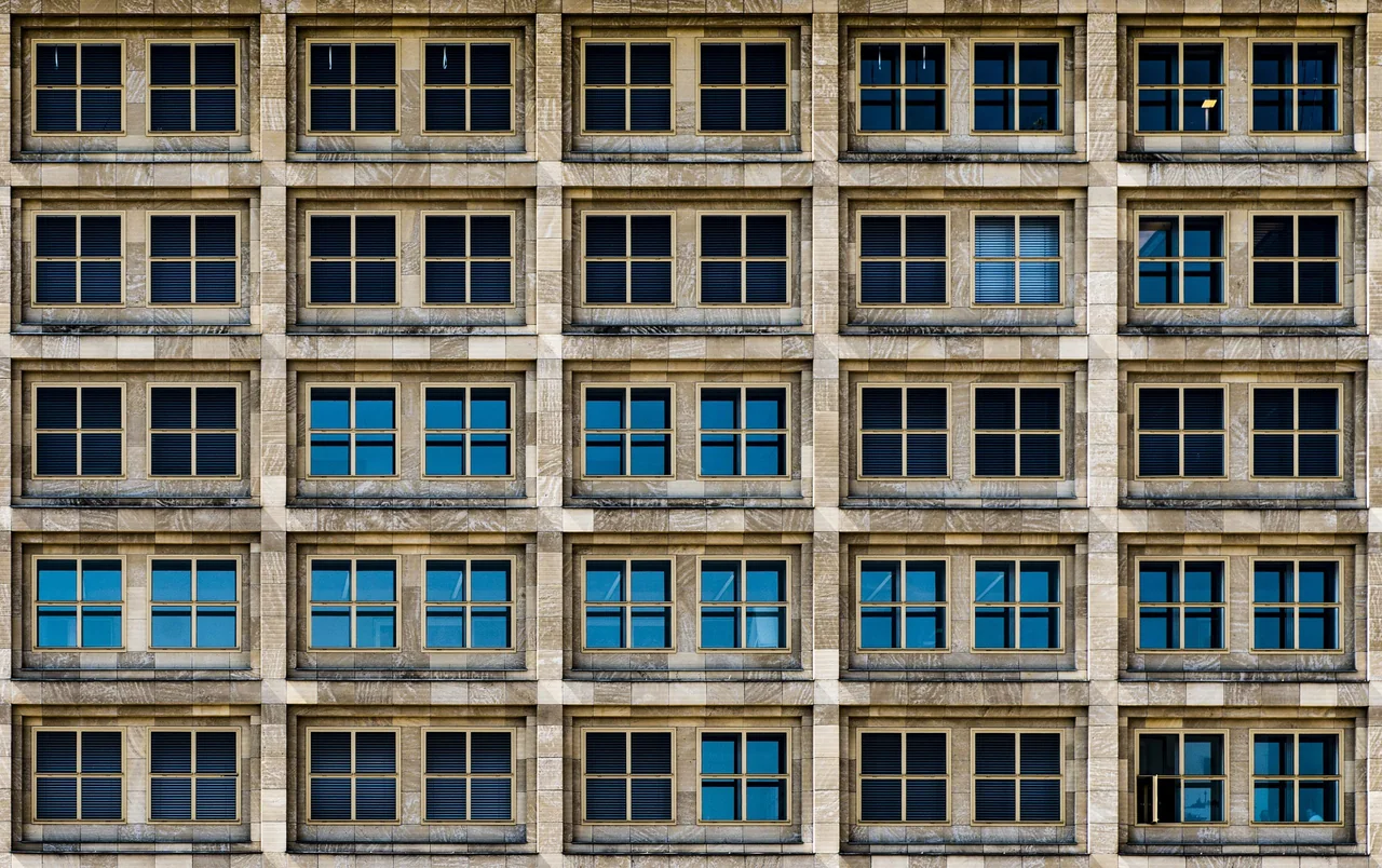 Grid of stone office windows